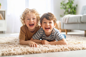 Happy Children Laughing on Living Room Carpet, a Photo by Davizro's Market