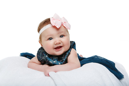 happy beautiful baby girl with bow