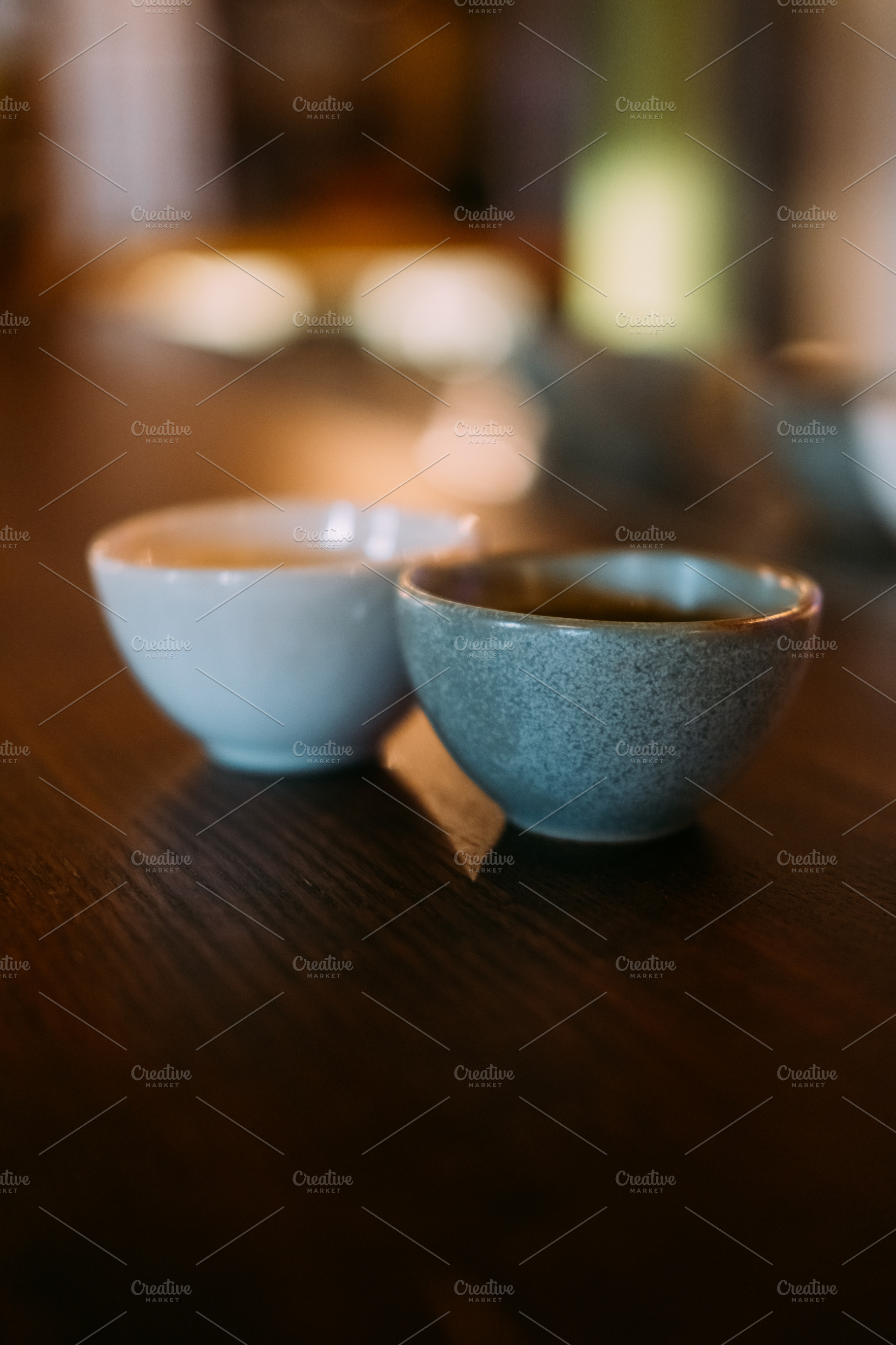 Sake cup serving alcoholic drink asian clay bowls, a Food & Drink Photo by Photo Drive Studio