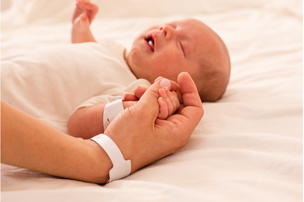 Newborn baby and mom are holding, a Health & Medical Photo by oksix