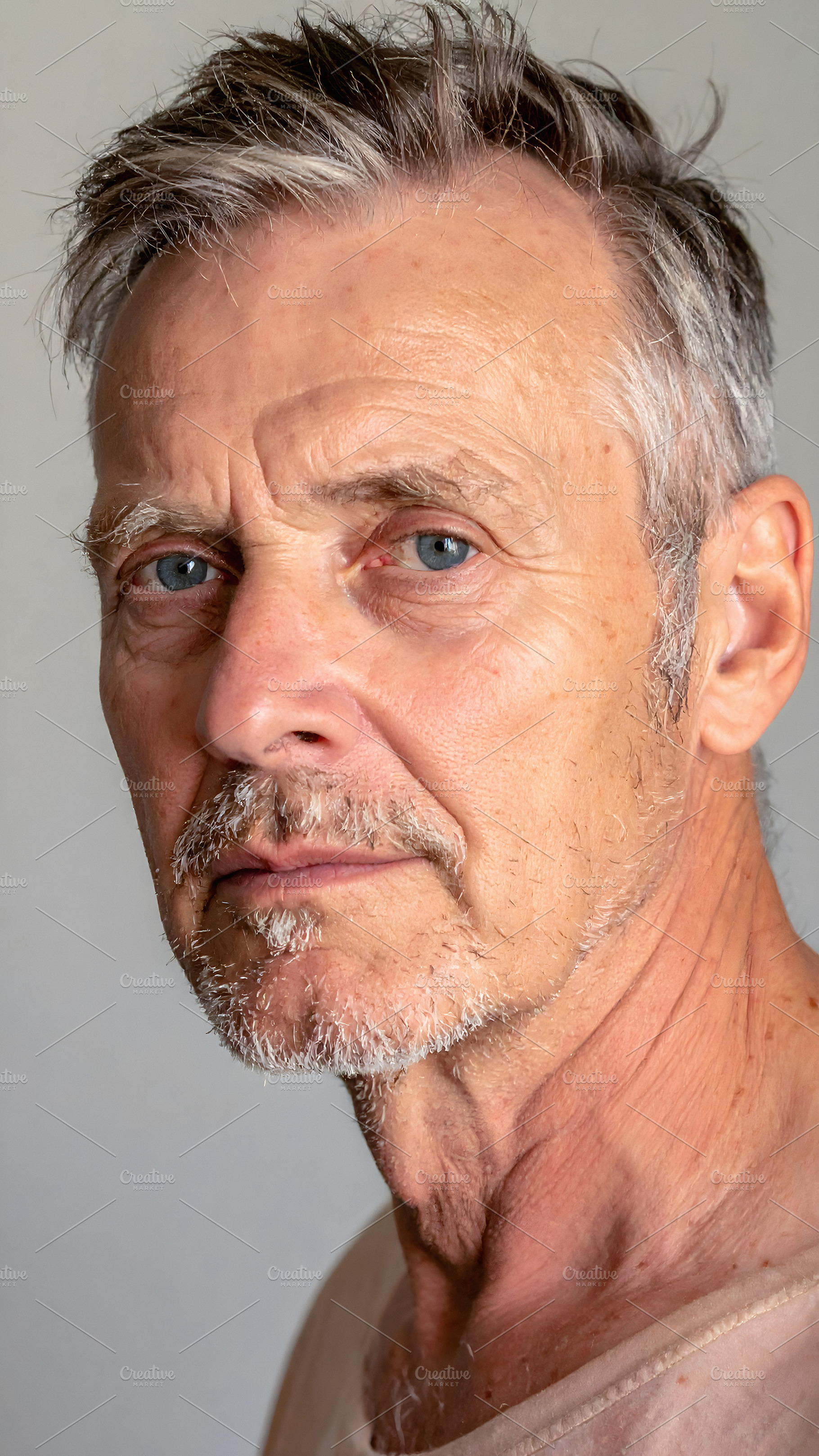 Mature senior man with piercing blue eyes and beard, a Person Photo by GoodGoods