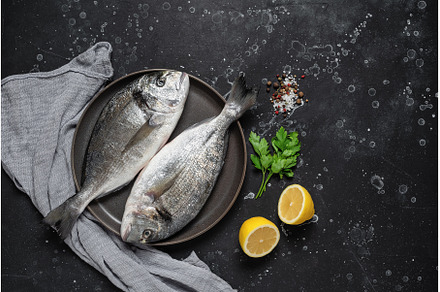 Fresh raw sea dorado fish with, a Food & Drink Photo by Yulia71