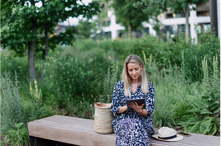 Mature woman sitting in park bench, a Person Photo by HalfPoint