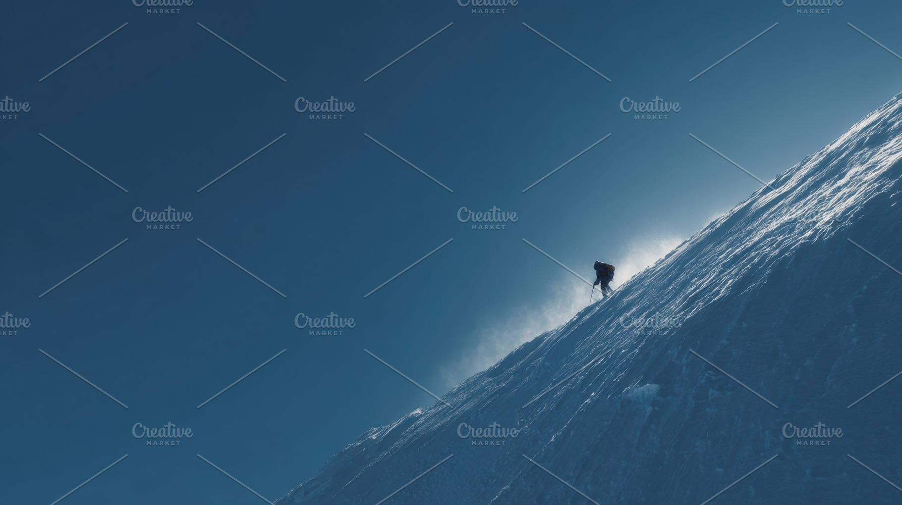 Climber ascends snowy mountain slope, a Photo by Beautiful things