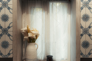 Window nook with flowers and tiles, an Architecture Photo by SkyNext