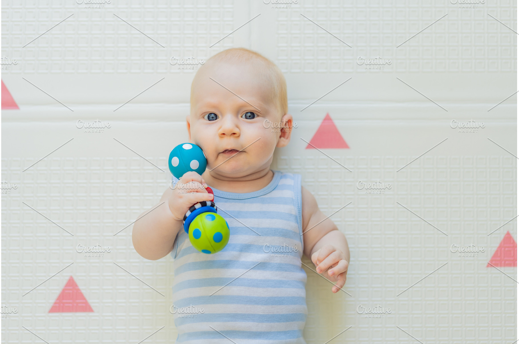 Adorable baby playing with colorful, a Person Photo by Elizaveta Galitskaya