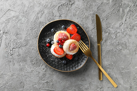 Concept of tasty sweet food, cheese pancakes, top view, a Food & Drink Photo by AtlasStudio PRO