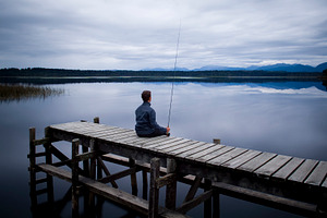 Fisherman On Jetty, a Person Photo by THP Creative