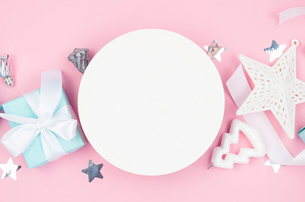 Holidays gift box wrapped in blue paper, balls, glitter on pink, a Holiday Photo by vimart