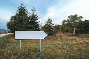 Blank road sign mock-up in nature, an Architecture Photo by SkyNext
