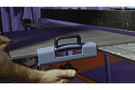 Close-up of man cutting tile, an Industrial Photo by Media Whale Stock