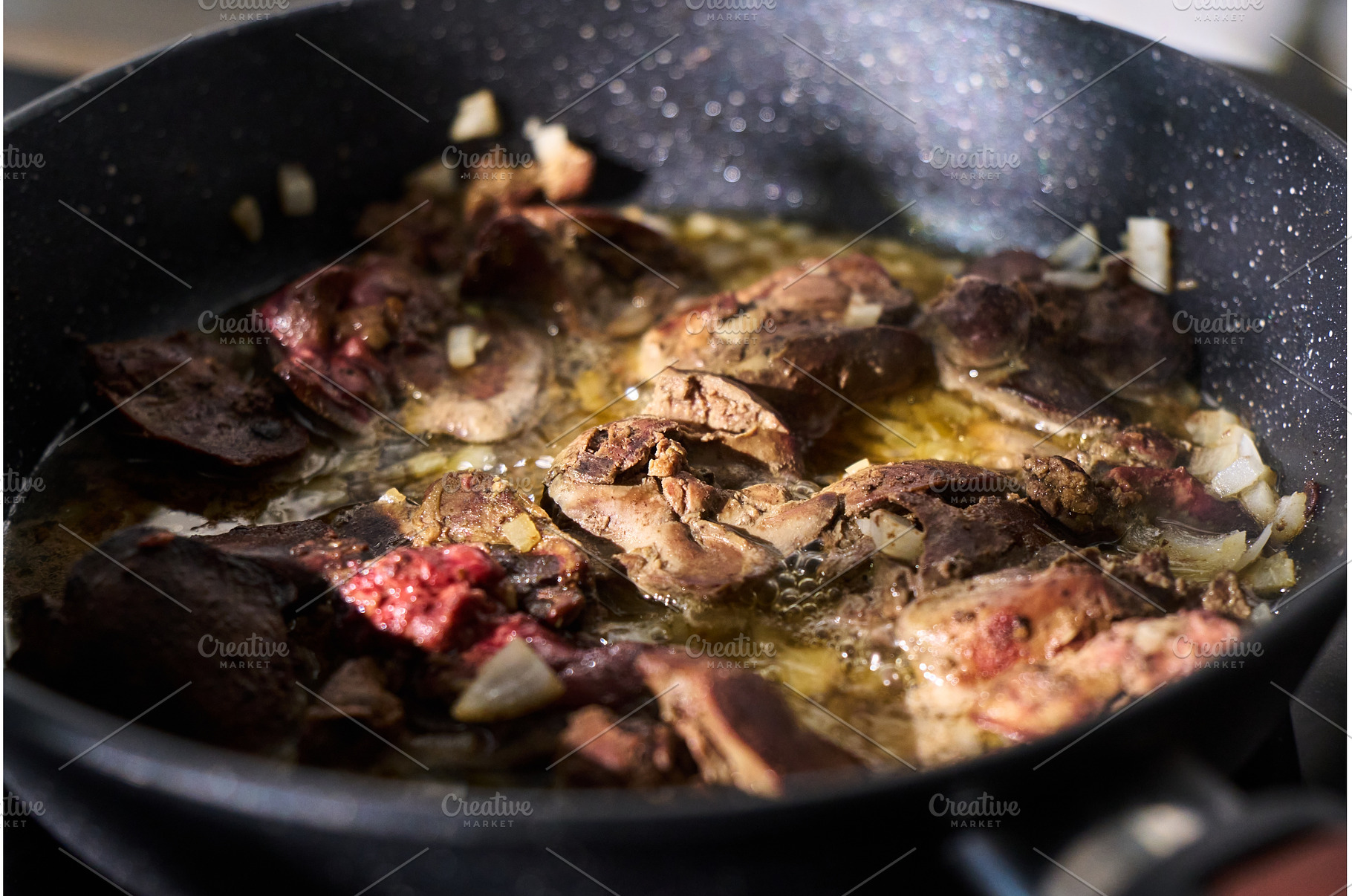 Cooking liver pieces in a frying pan, a Food & Drink Photo by darksoul72