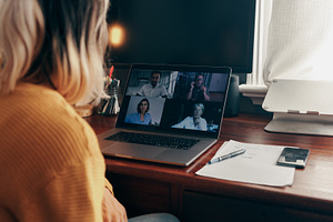 Businesswoman attending a virtual meeting while working from hom, a Person Photo by Jacob Lund