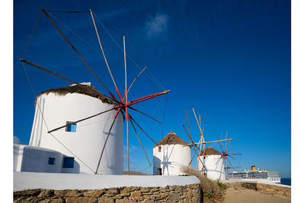 Traditional greek windmills on, an Architecture Photo by f9photos