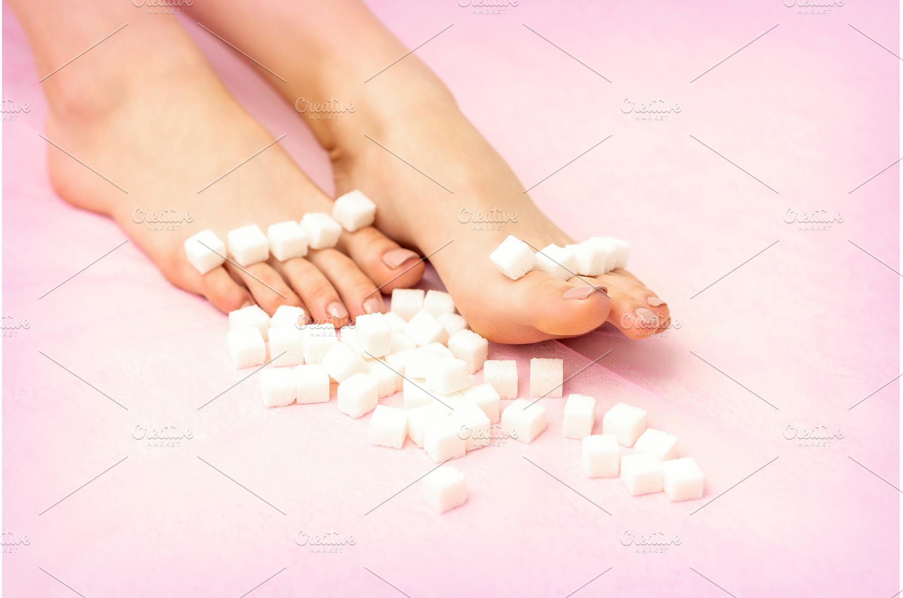Sugar cubes lying in a row on female, a Beauty & Fashion Photo by okskukuruza