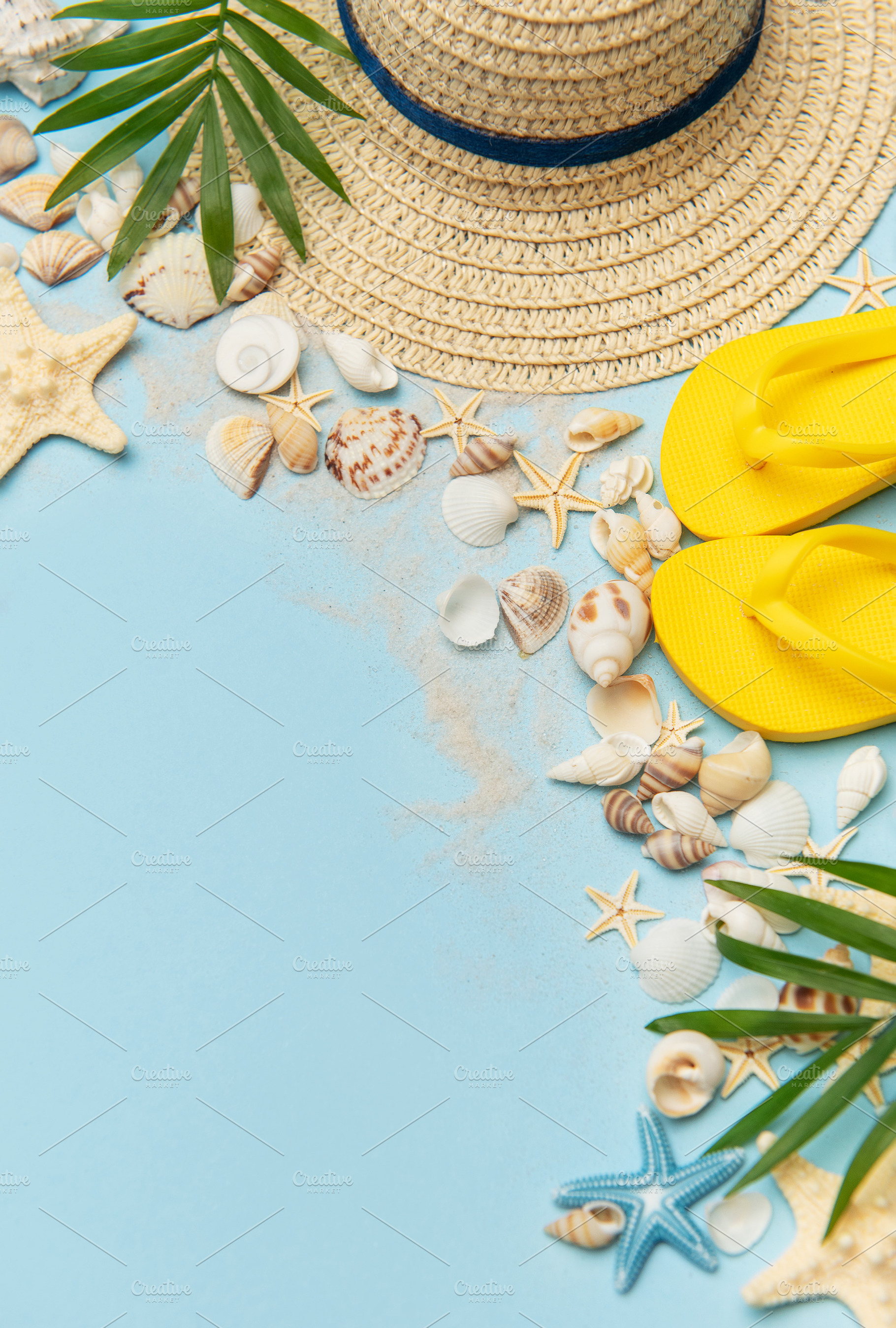 Beach accessories creating summer holiday mood on blue backgroun, a Holiday Photo by Olena Rudo