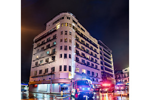 Firefighters at a burning building, an Architecture Photo by Leonid Andronov