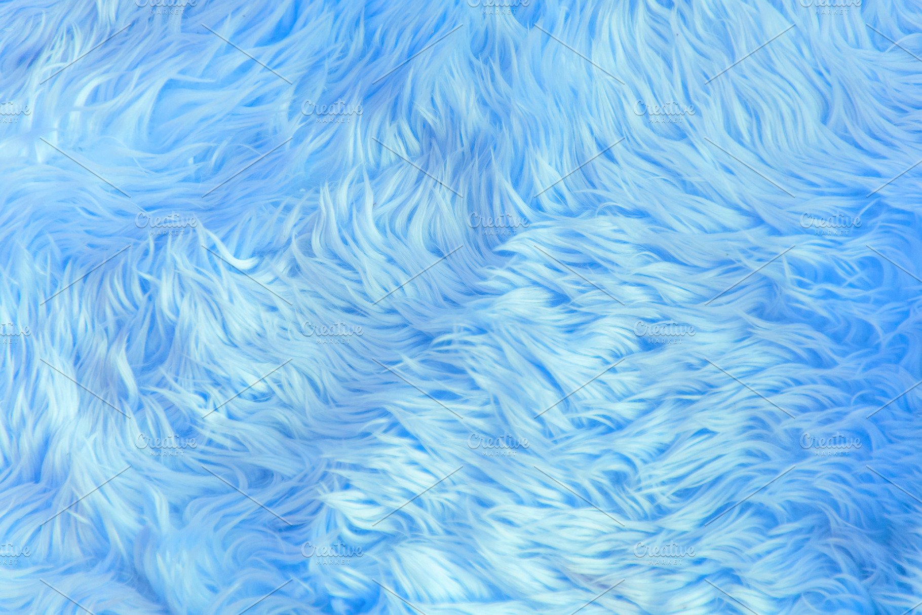Close up blue fur texture or carpet, an Abstract Photo by Casanowe-studio
