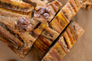 Pastry background banana bread served cut pieces, a Food & Drink Photo by Photo Drive Studio