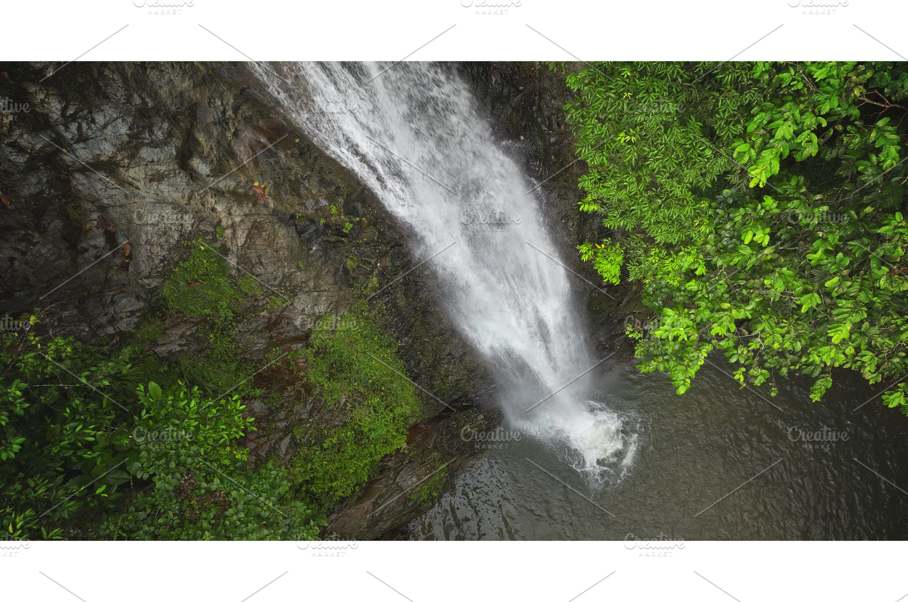 Waterfall cascading down rocky cliff, an Animal Photo by Goinyk
