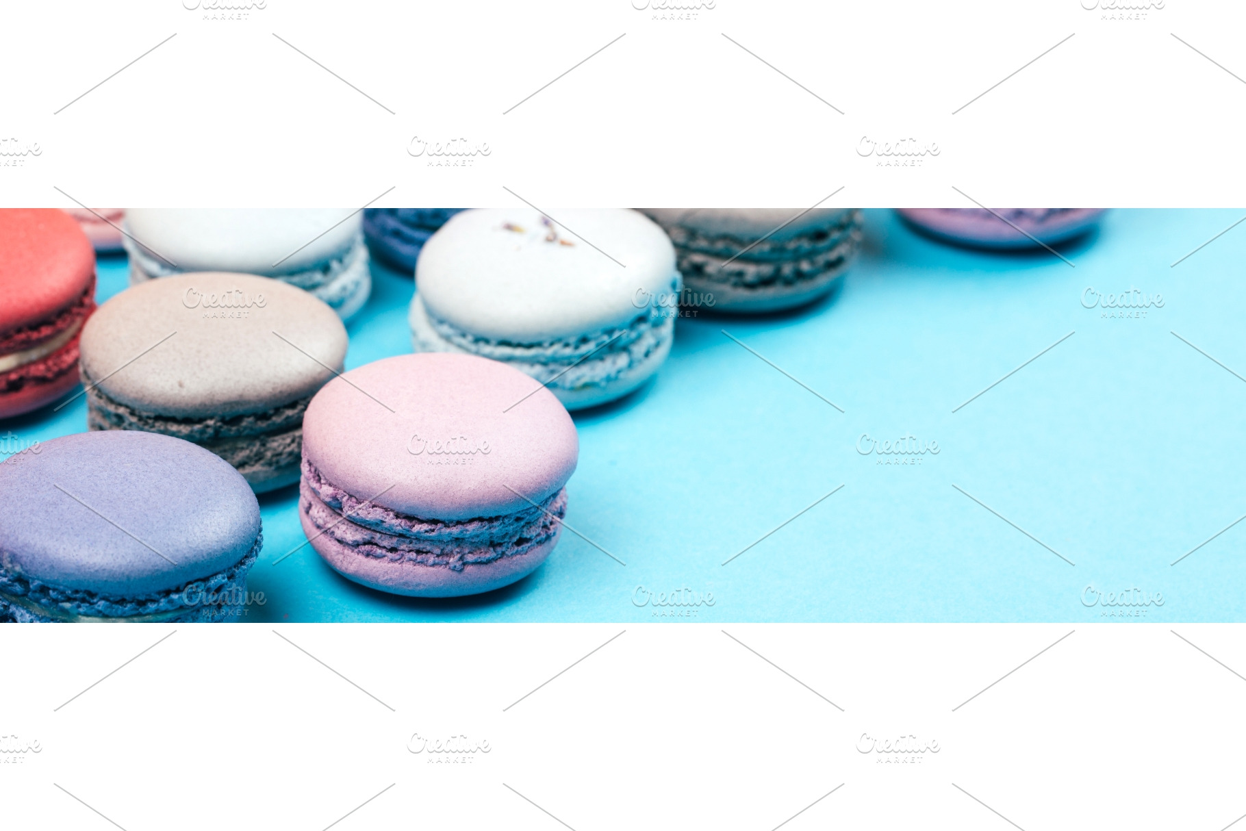 Macarons on blue with copy space for, a Food & Drink Photo by Anna Efetova