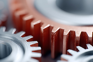 Close up of interlocking metal gears, an Industrial Photo by MistyDay