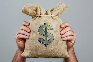 Male hands holding burlap bag with dollar symbol and banknotes on grey backgrou, a Business Photo by AlyaAnd