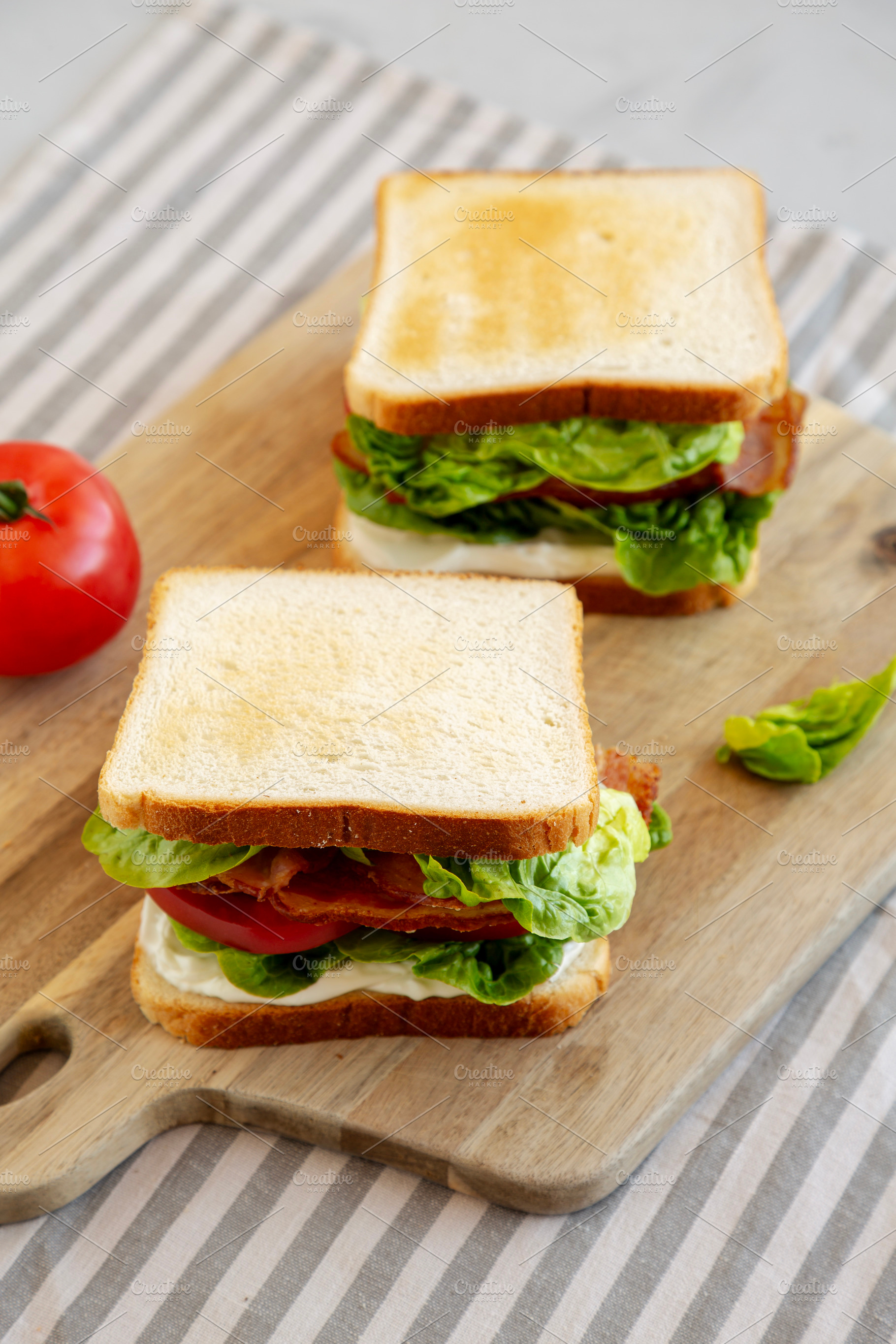 Homemade BLT (Bacon Lettuce Tomato) Sandwich with Mayo, side vie, a Food & Drink Photo by LiudmylaChuhunova