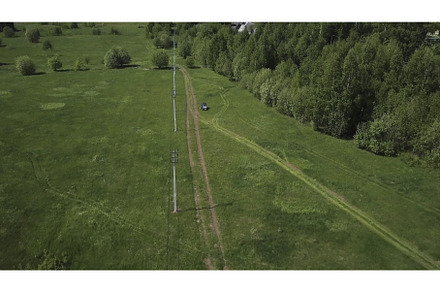 Top view of car driving on field, a Transportation Photo by Media Whale Stock