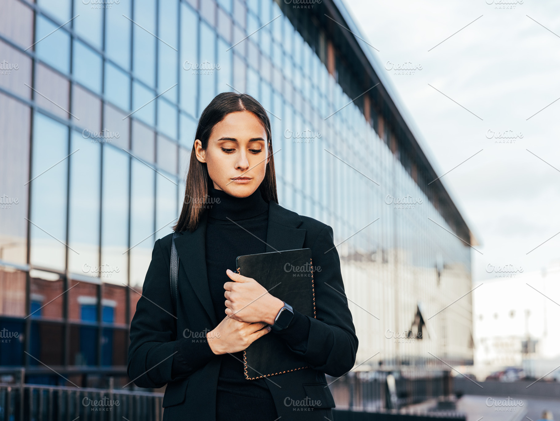 Confident businesswoman in black, a Business Photo by Artem Varnitsin