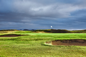 Landscape view of golf course in iceland stock photo containing golf and field