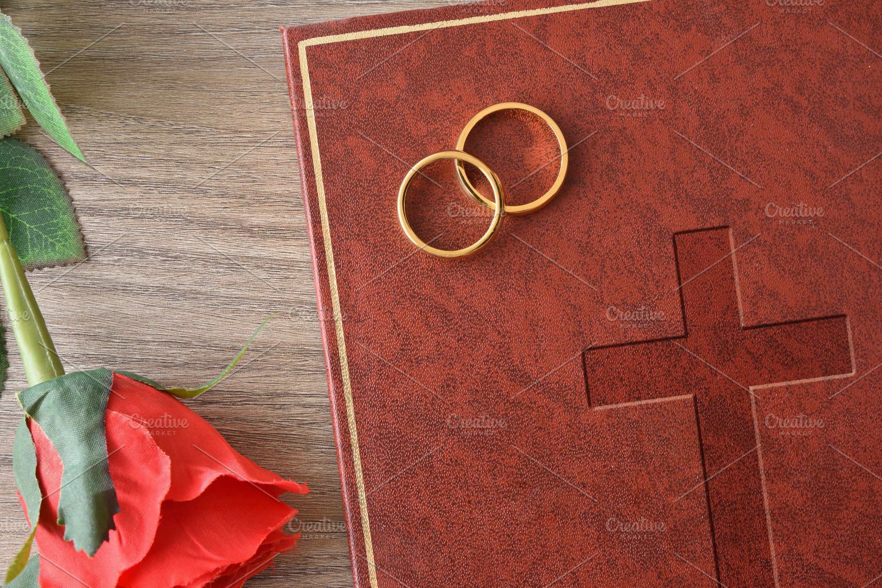 Gold Rings and Red Rose Beside a Leather Book, an Abstract Photo by Davizro's Market