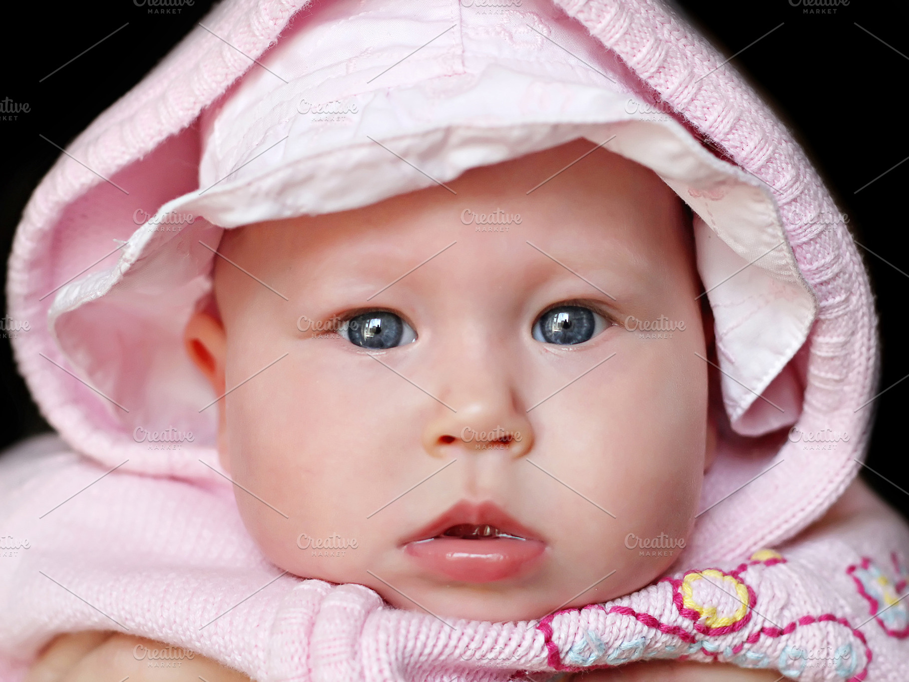 Newborn baby close up, a Photo by saiko3p