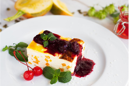 Close up of cheesecake with cherry, a Food & Drink Photo by Photo Drive Studio