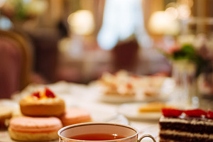 Afternoon tea service setting in an elegant luxury hotel restaur, a Food & Drink Photo by Studio ANNA
