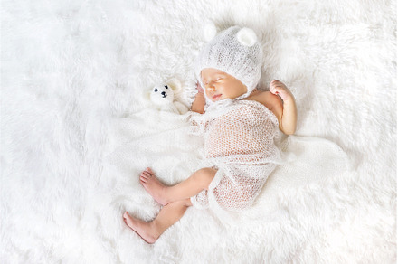 Newborn baby sleeps in a hat, a Beauty & Fashion Photo by yanadjana
