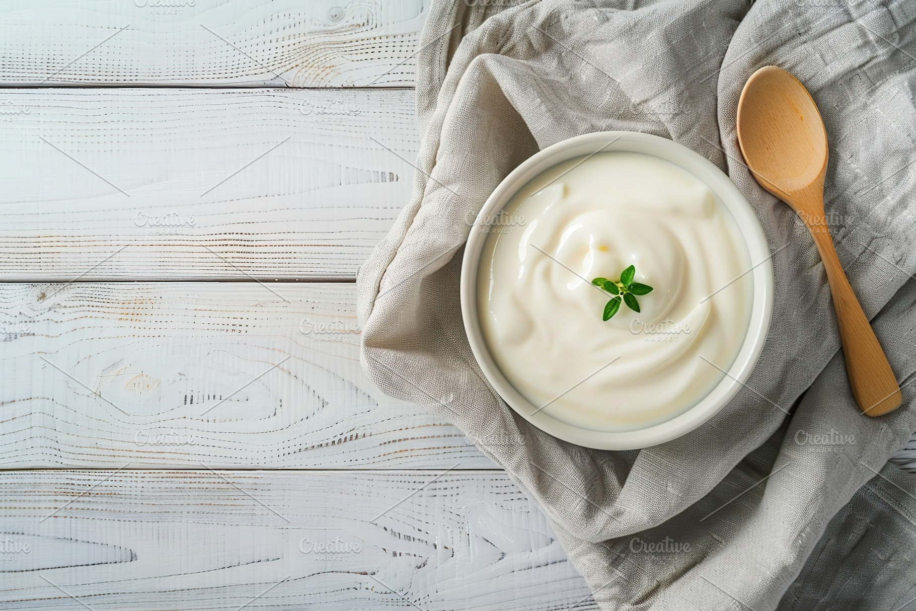 Bowl with white yogurt and napkin on wooden table, a Food & Drink Photo by AlyaAnd