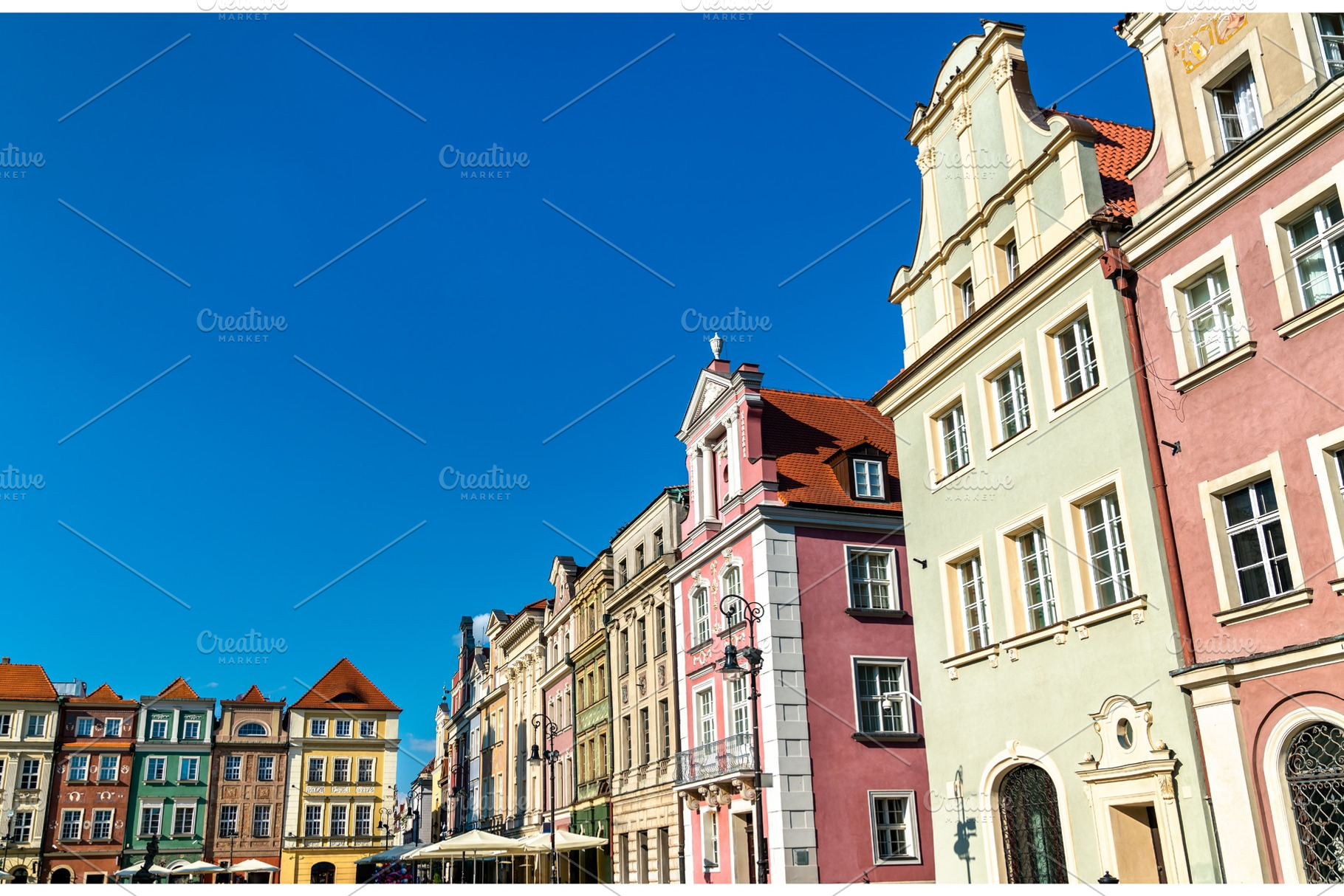 Traditional houses on the old market containing poland, poznan, and city, an Architecture Photo by Leonid Andronov