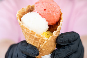 Ice cream seller sweet treat gelato worker hand, a Food & Drink Photo by Photo Drive Studio