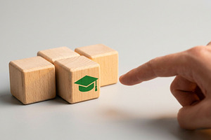 Wooden Block with Graduation Cap, a School & Education Photo by thepslr