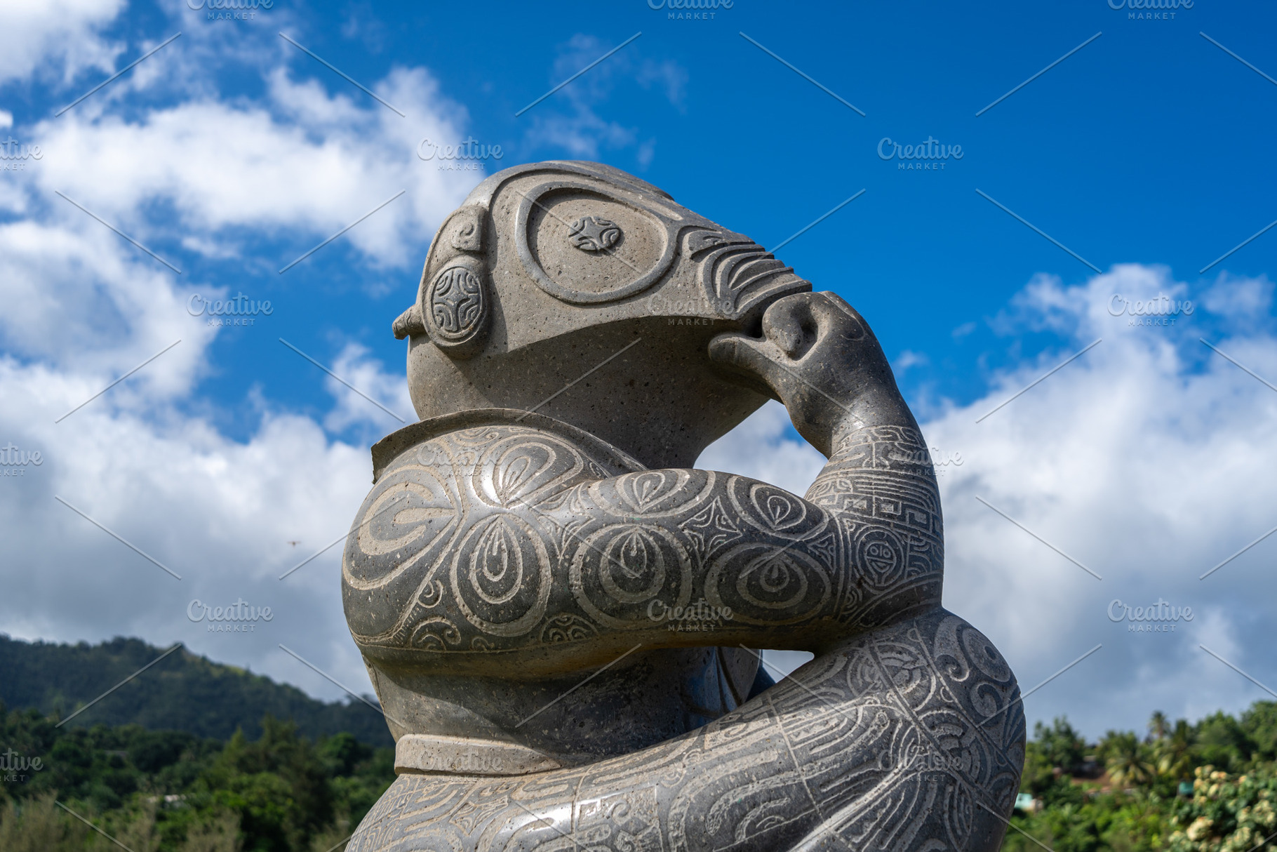 Stone tiki statue in Atuona Bay, Hiva Oa, Marquesas Islands, an Arts & Entertainment Photo by GoodGoods