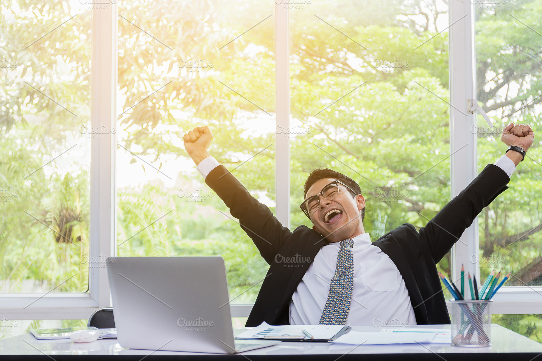 Success businessman are happy in his stock photo containing young and happy, a Person Photo by Guitarfoto Studio