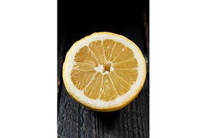 Macro photo of a sliced lemon on a, a Food & Drink Photo by Stockphoto by vzwer