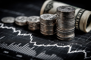 Coin stacks and dollar bills on stoc, a Photo by Pixeness Studio