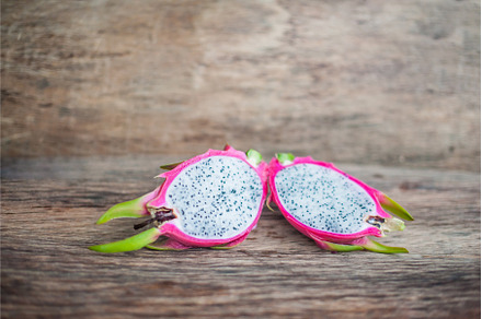 Healthy dragon fruits on old wooden, a Food & Drink Photo by Elizaveta Galitskaya