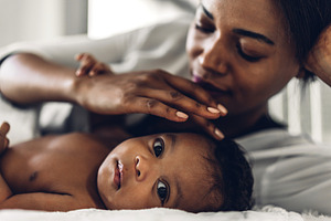 Portrait of enjoy happy love family african american mother play