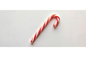 Red and white candy cane on white, a Holiday Photo by piter.goskov