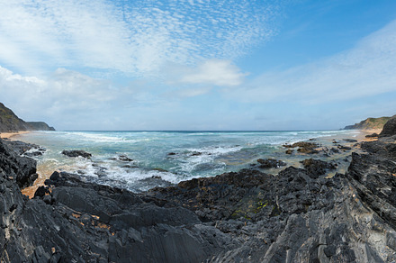 Storm on Castelejo beach with black schist stone cliffs and yell, a Nature Photo by YuriyB