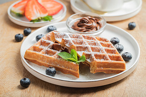 Belgium waffles Homemade waffles with strawberries, a Food & Drink Photo by Budarinphoto