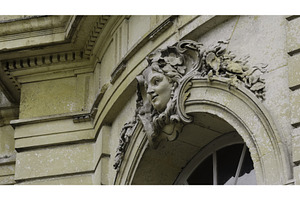 Stone woman face sculptures adorning, an Architecture Photo by Media Whale Stock